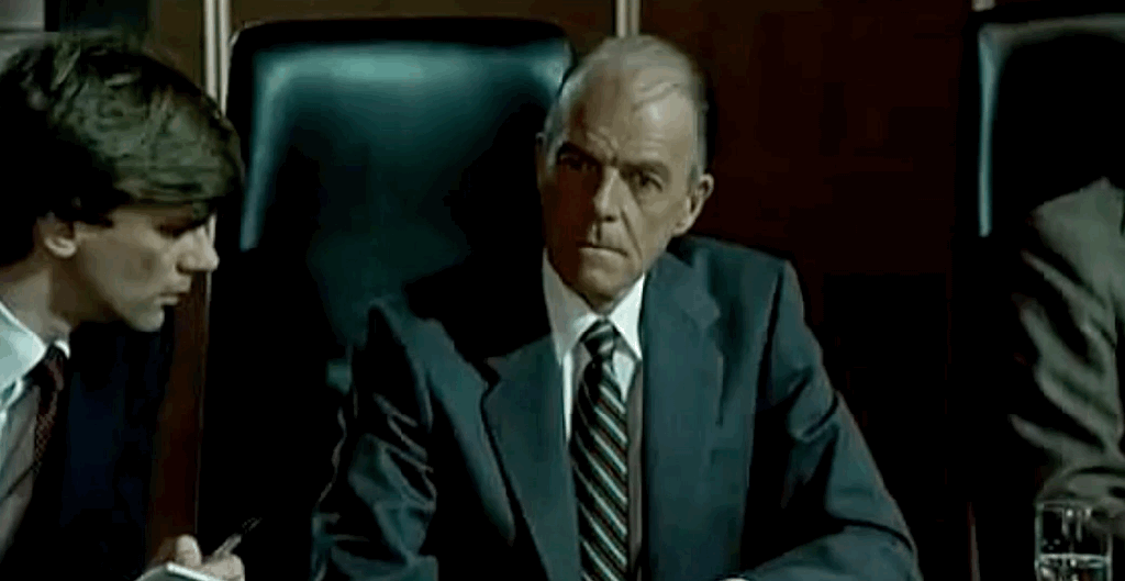 US Ambassador buries his had in his hand in frustration