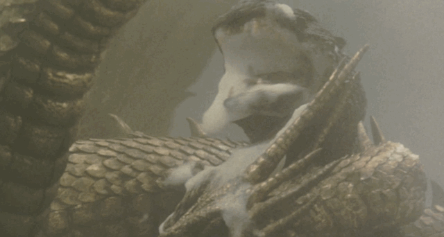 Godzilla pulse attacks King GHidorah, then uses atomic breath to sever the middle head, which flies straight up