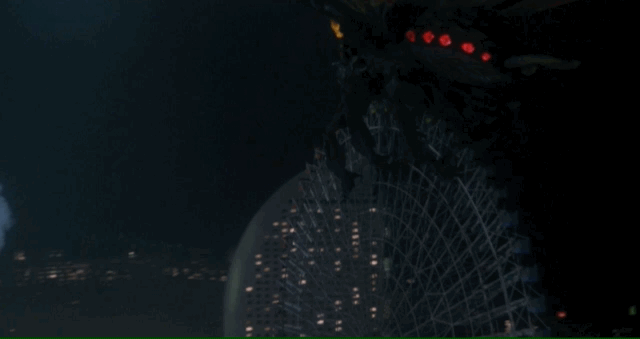 Battra hucks a giant ferris wheel at Godzilla