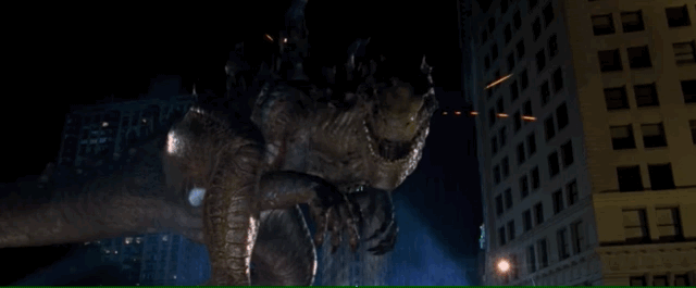 Godzilla ducks and missile fly past destroying New York's triangular Flatiron building