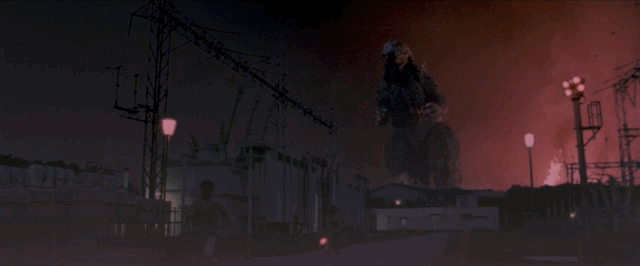 Godzilla roars and marches towards a power plant, a physical suit is refreshing to see
