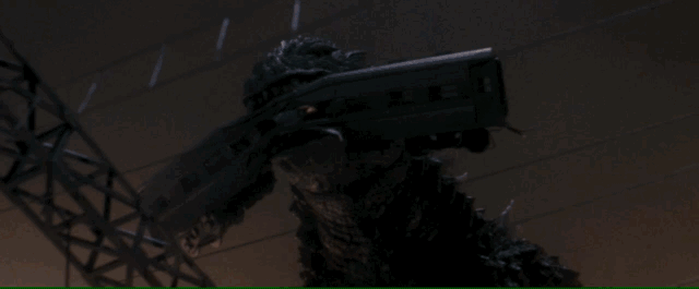 Modern Godzilla blasts atomic breath and chews a train, recreating classic 1954 scenes
