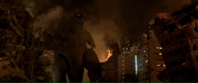 Low angle shot of Godzilla charging forward with speed