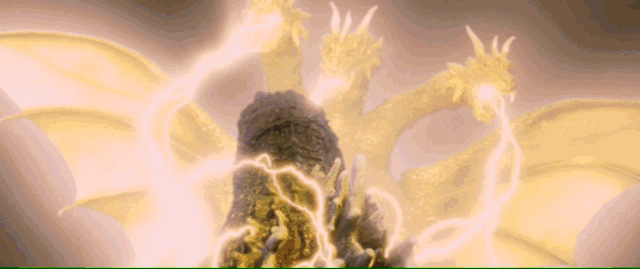 The three heads of the golden dragon King Ghidorah spout lightning, but Godzilla fires a blast in retaliation, causing an explosion