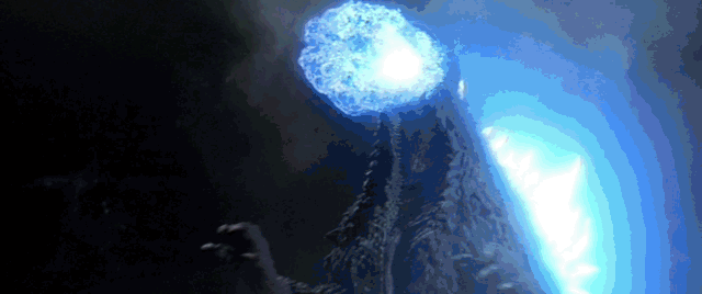 Kiryu fires missiles around a building, but Godzilla atomic blasts his way right through it.