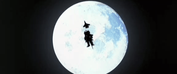 Kiryu drops from the sky with moon behind him, skids and shoulder checks Godzilla