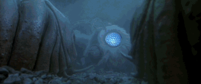 Mothra rises to intercept Godzilla's atomic beam, bursting into flame, saving her young larvae whos eyes turn from blue to red